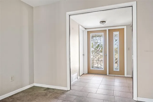 a view of livingroom with a ceiling fan and window
