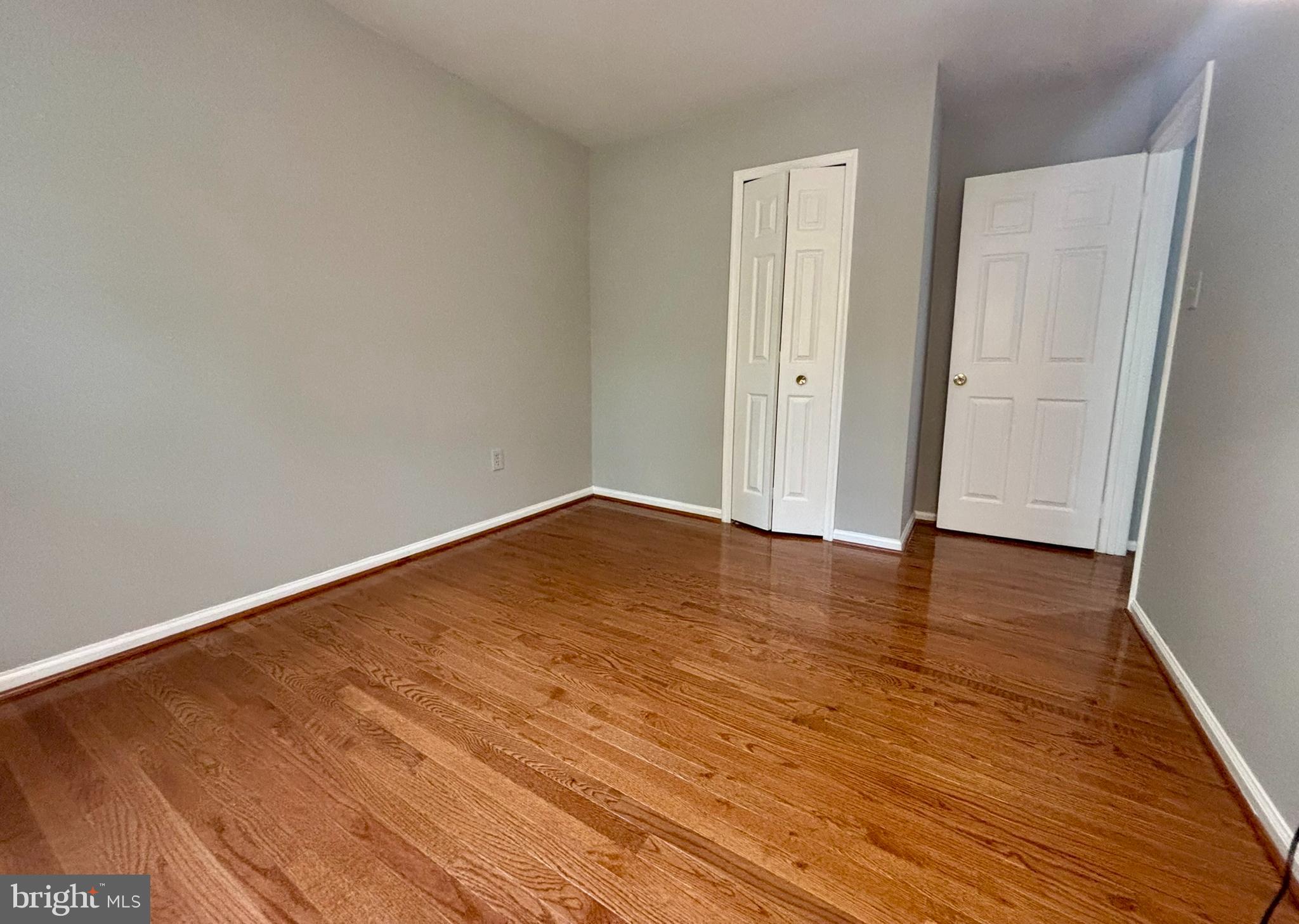 9004 Mulvaney Court Springfield, VA 22152 - Photo 19 of 23 a view of empty room with wooden floor