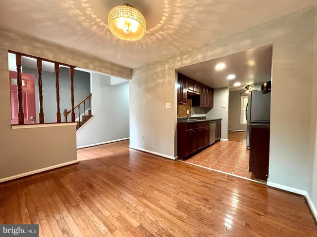 a view of a kitchen with a sink and an oven