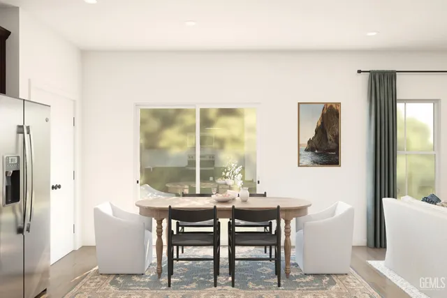 a dining room with furniture and window