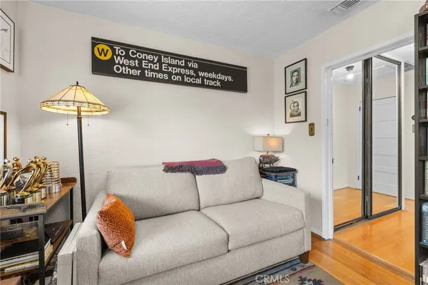 a living room with furniture and a lamp