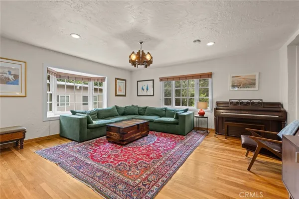 a living room with furniture and a rug