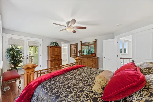 a bed room with a bed and a chandelier