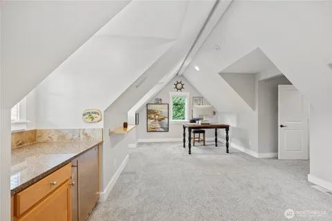 a view of living room with furniture and a window