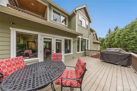 a view of a house with a large window and wooden floor