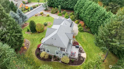 an aerial view of a house with outdoor space