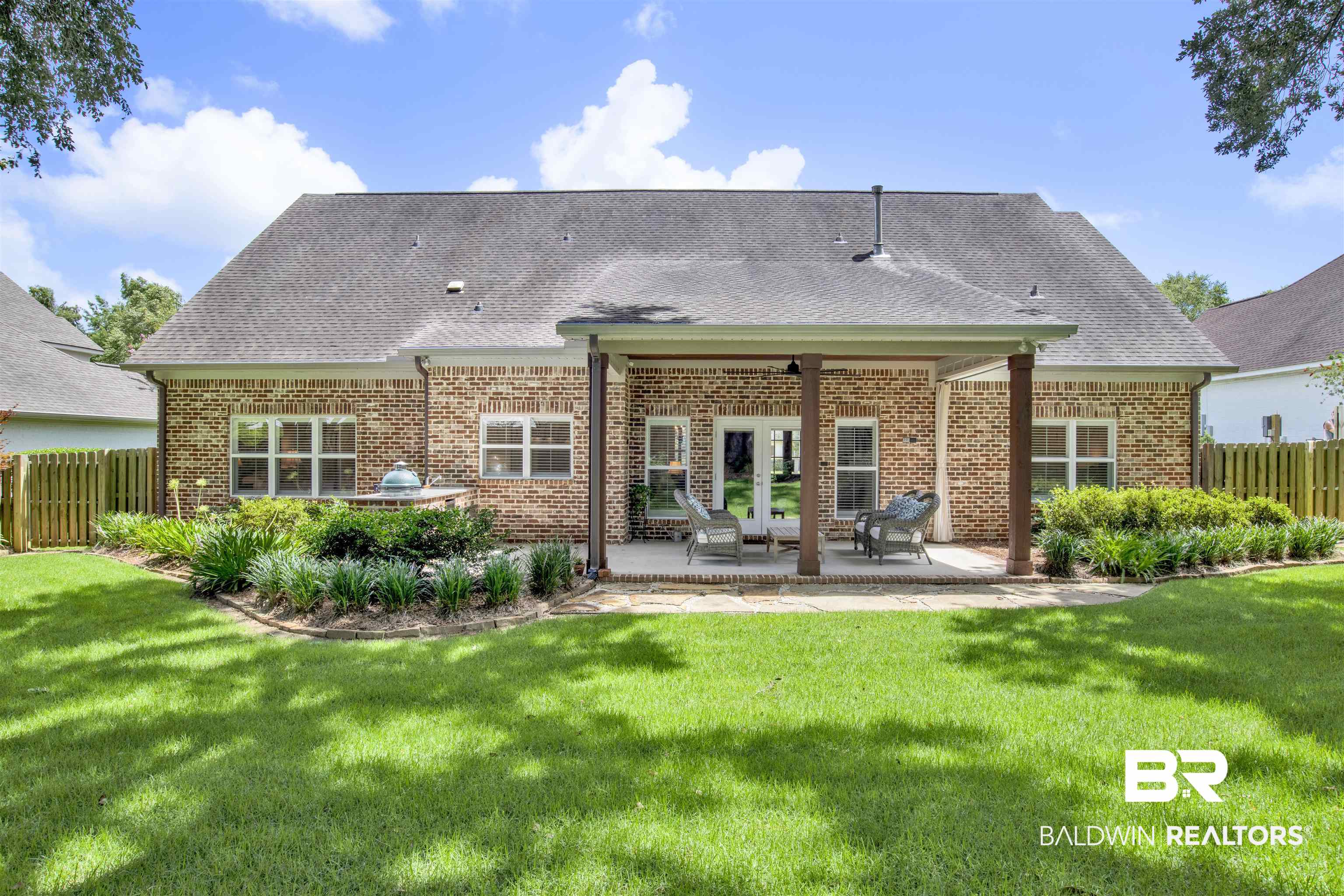 131 Sedgefield Avenue Fairhope, AL 36532 - Photo 38 of 50 Rear view of property featuring a yard and a patio area