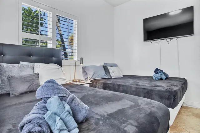 a bathroom with a sink a granite counter and a mirror