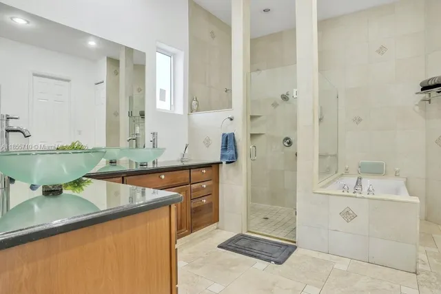 a living room with furniture a flat screen tv and a walk in closet
