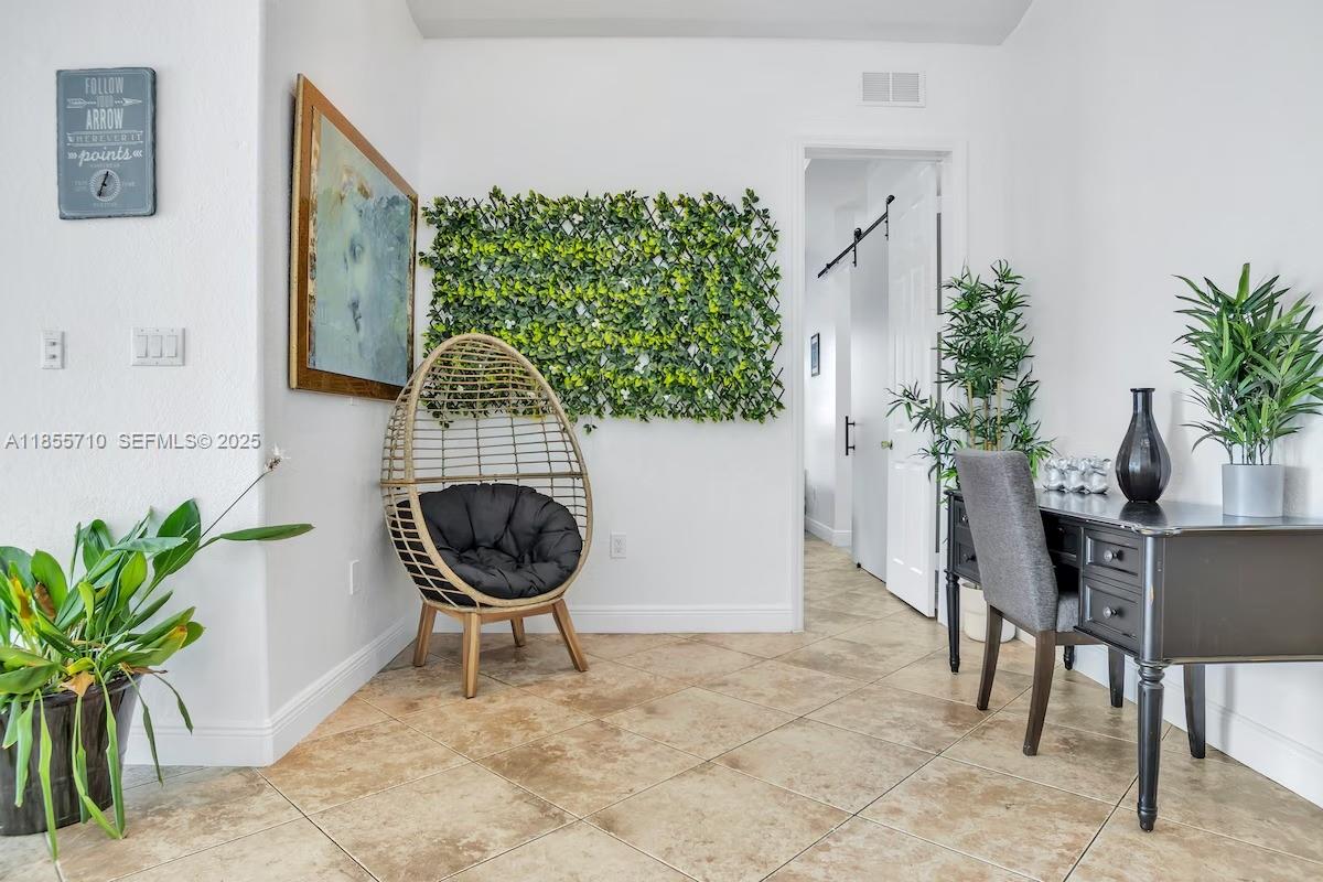 205 North 31st Avenue, Unit 1 Hollywood, FL 33021 - Photo 16 of 42 a vase of flowers sitting on a table