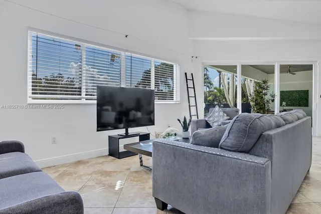 a view of an house with backyard space and swimming pool