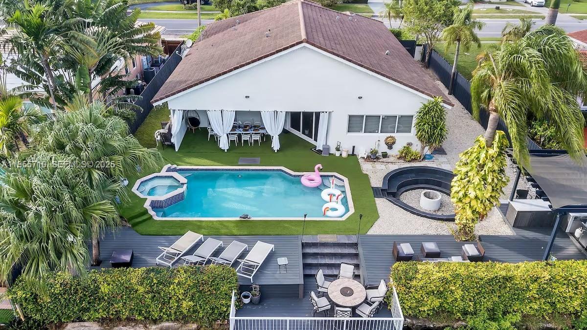 205 North 31st Avenue, Unit 1 Hollywood, FL 33021 - Photo 25 of 42 a view of an house with backyard space and swimming pool