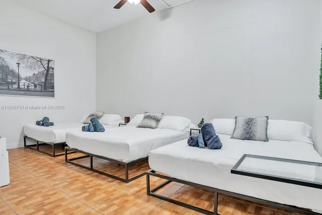 a view of multiple houses with a yard and potted plants