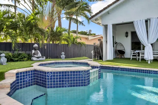 a view of a swimming pool with chairs