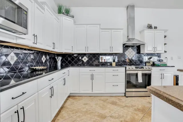 a view of kitchen with dining table and chairs
