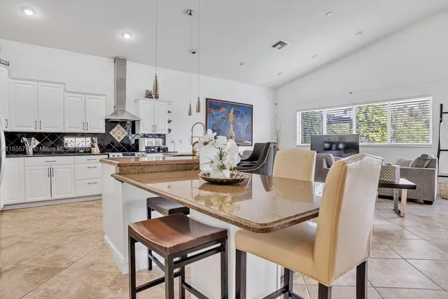 a bedroom with a bed and a television