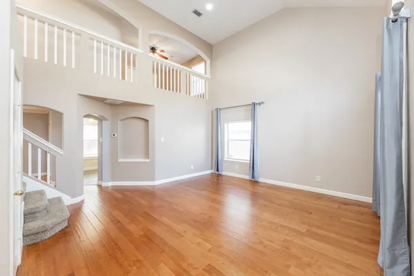 a view of an entryway with wooden floor