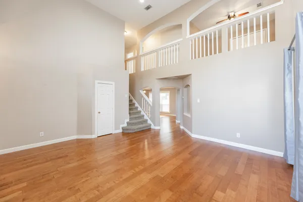a view of an entryway with wooden floor