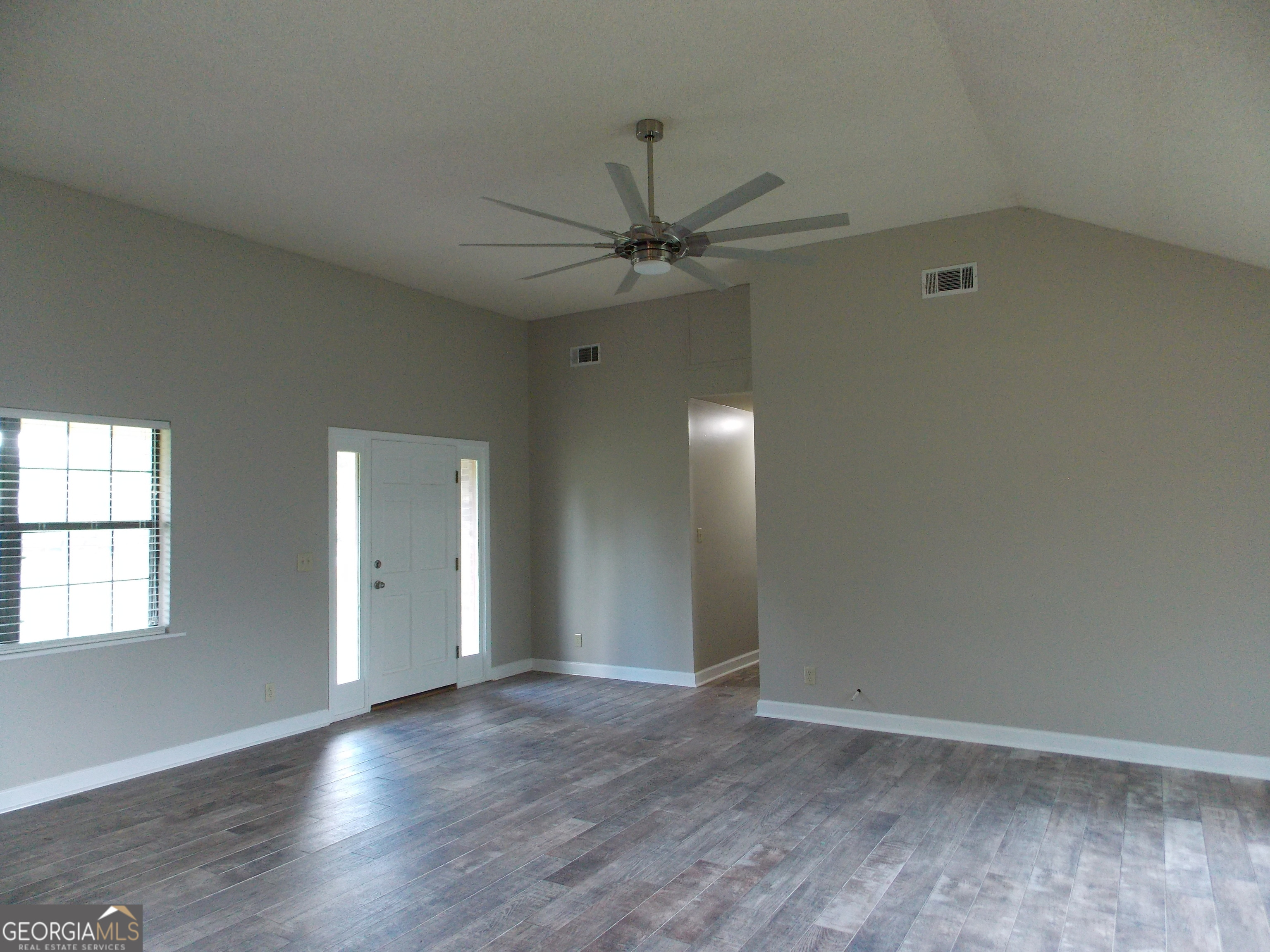 224 Pretoria Rushing Road Statesboro, GA 30461 - Photo 3 of 11 wooden floor in an empty room with a window