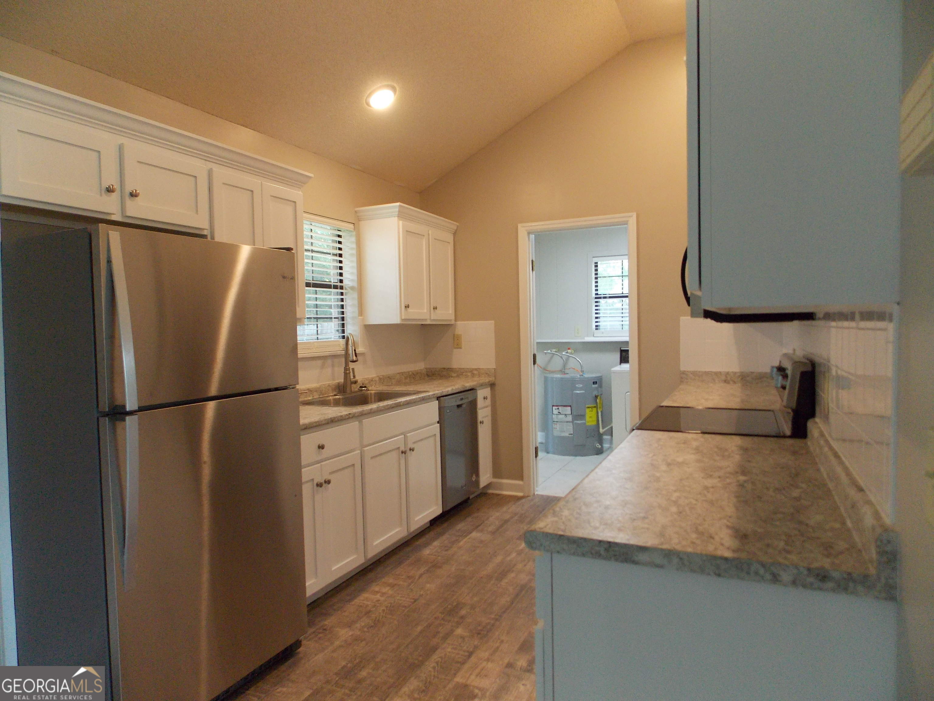 224 Pretoria Rushing Road Statesboro, GA 30461 - Photo 5 of 11 a kitchen with a refrigerator sink and cabinets