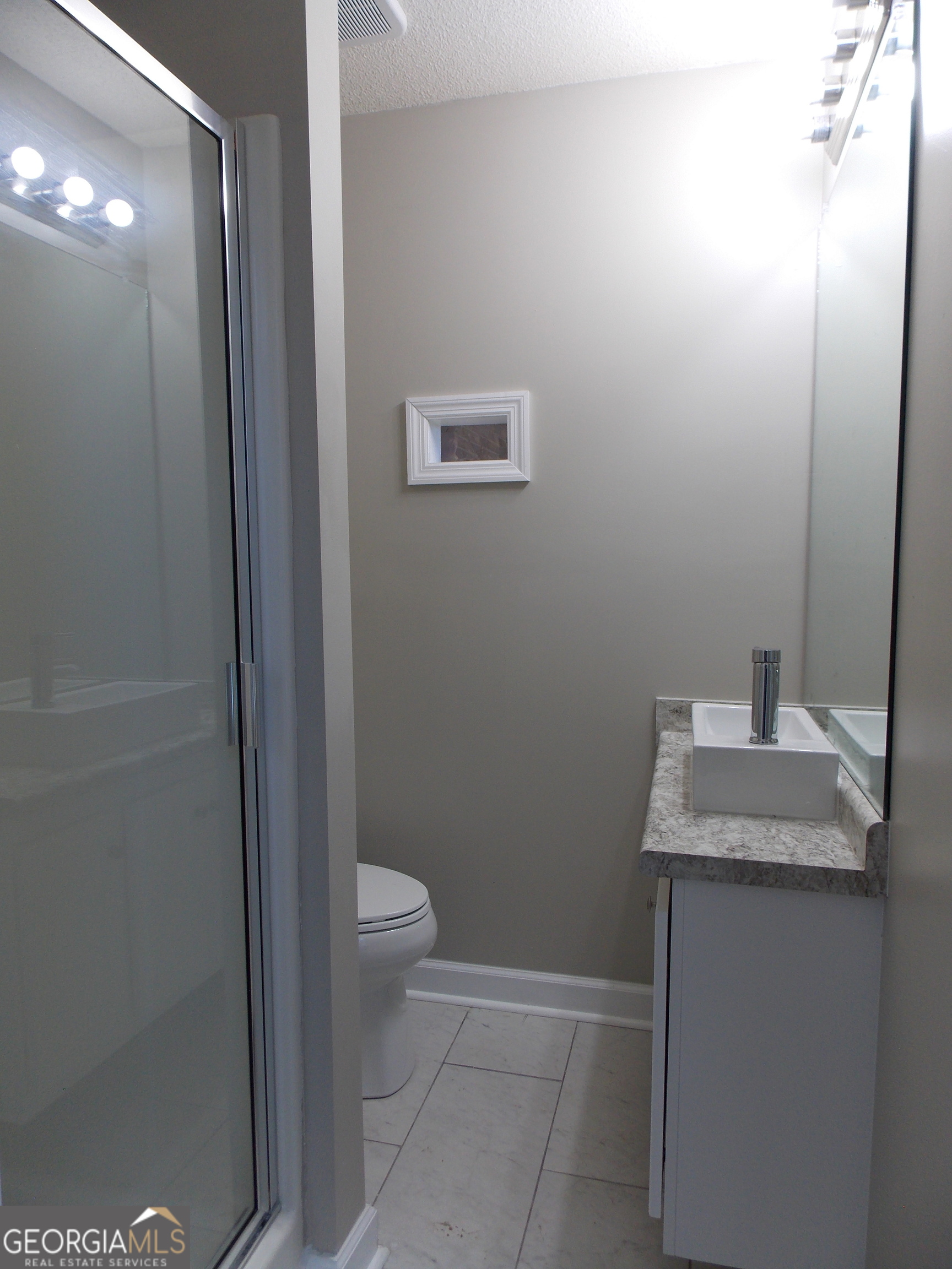 224 Pretoria Rushing Road Statesboro, GA 30461 - Photo 6 of 11 a bathroom with a granite countertop sink and a toilet