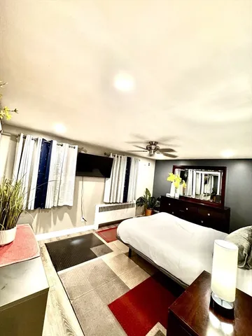 a living room with furniture and a night stand