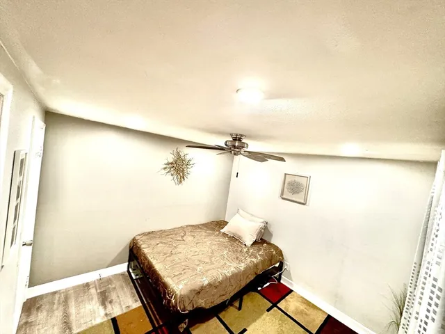 a bedroom with a bed and a table in it