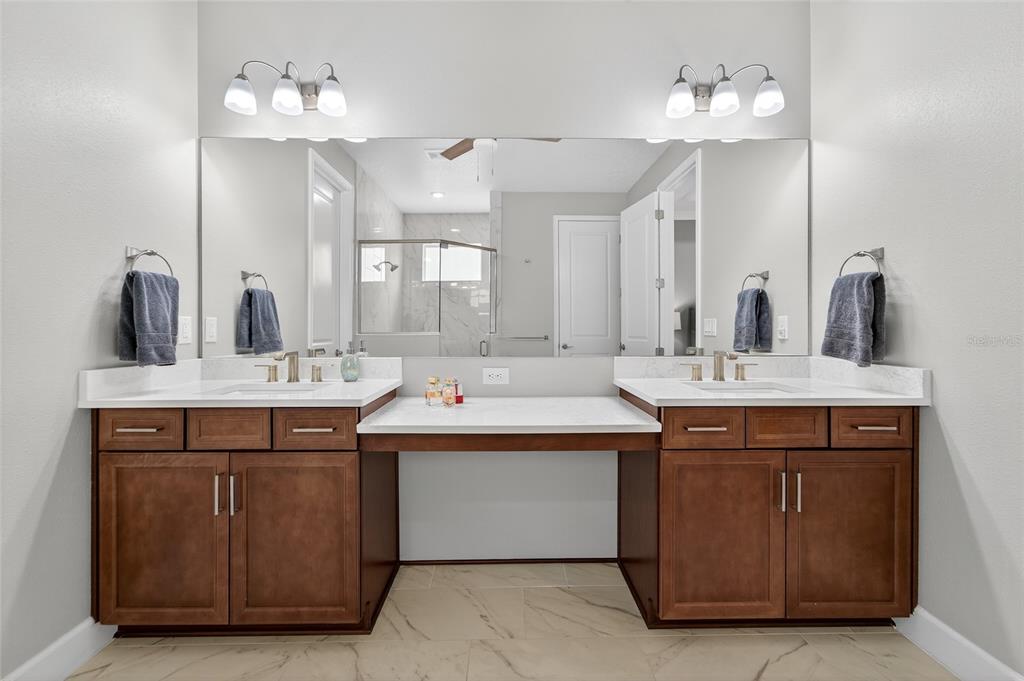 5961 Blakeney Loop Apollo Beach, FL 33572 - Photo 14 of 42 a bathroom with a sink double vanity and a mirror