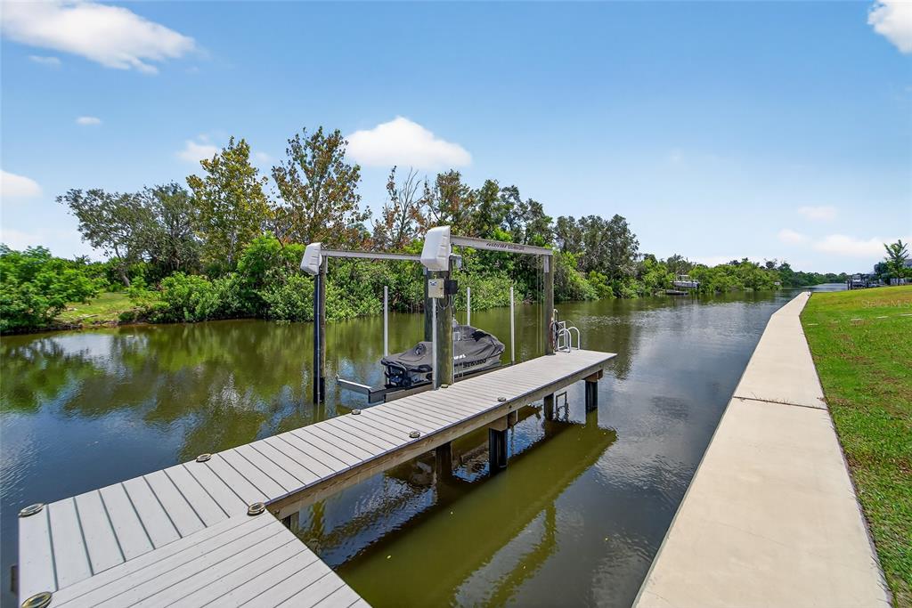 5961 Blakeney Loop Apollo Beach, FL 33572 - Photo 20 of 42 a view of a lake with sitting area