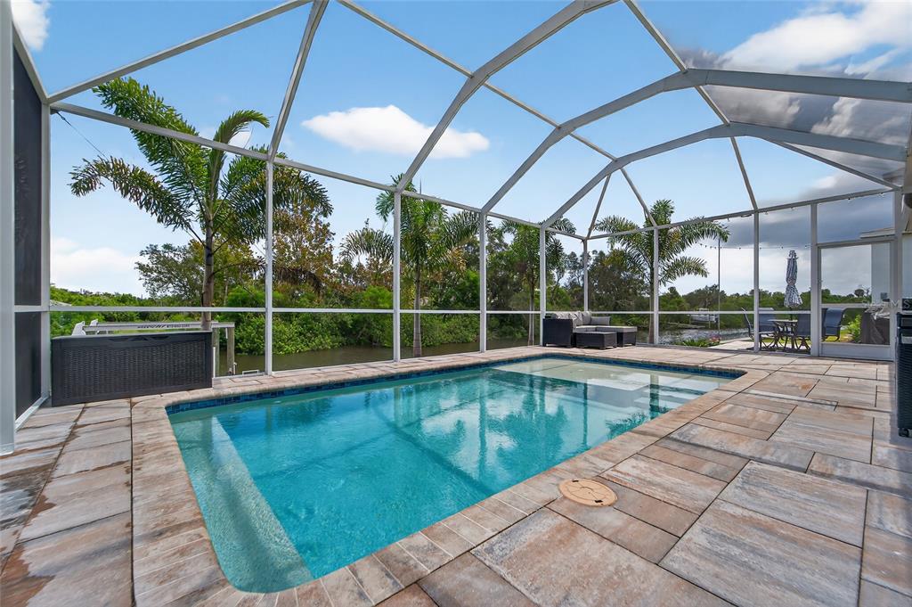 5961 Blakeney Loop Apollo Beach, FL 33572 - Photo 4 of 42 a view of a swimming pool with a porch