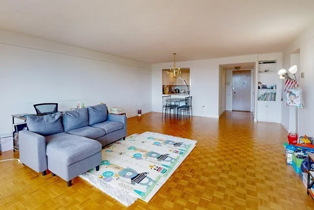 a living room with furniture and a table