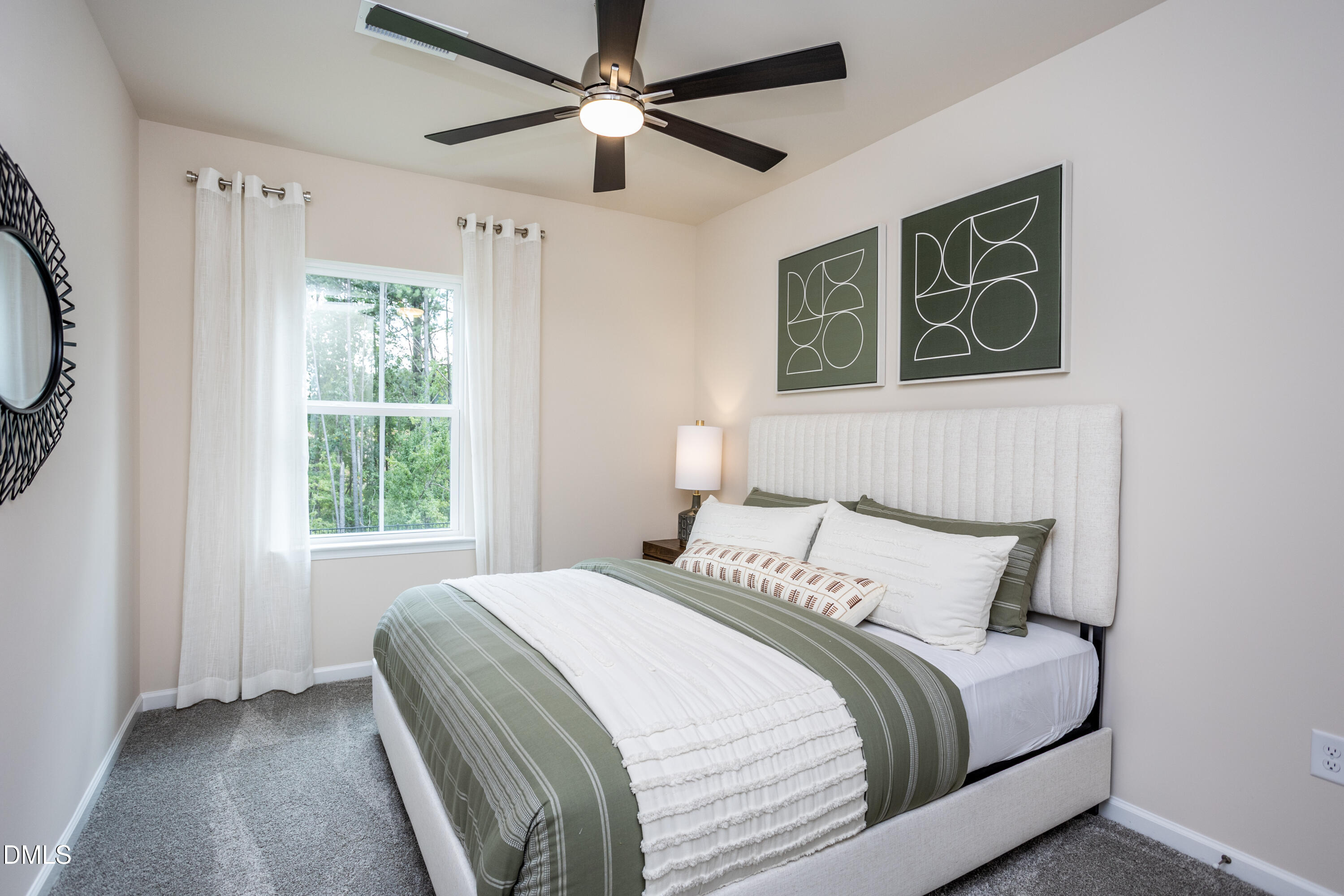 657 Ben Ledi Court Raleigh, NC 27603 - Photo 15 of 32 a bedroom with a large bed and a window