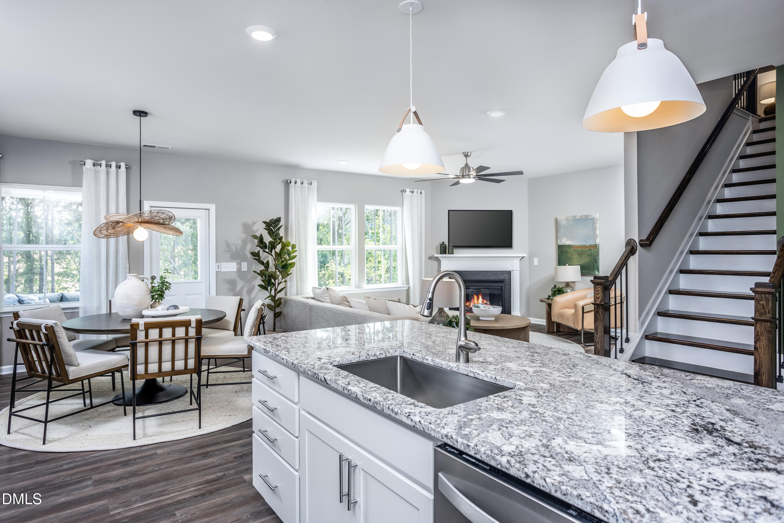 657 Ben Ledi Court Raleigh, NC 27603 - Photo 5 of 32 a kitchen with sink cabinets and outdoor living space