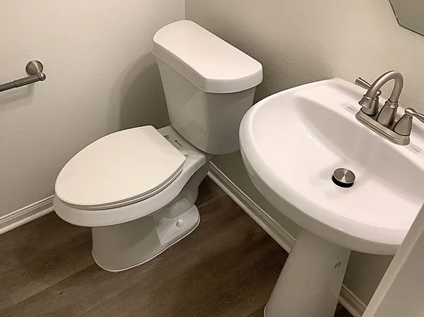a bathroom with a toilet and a sink