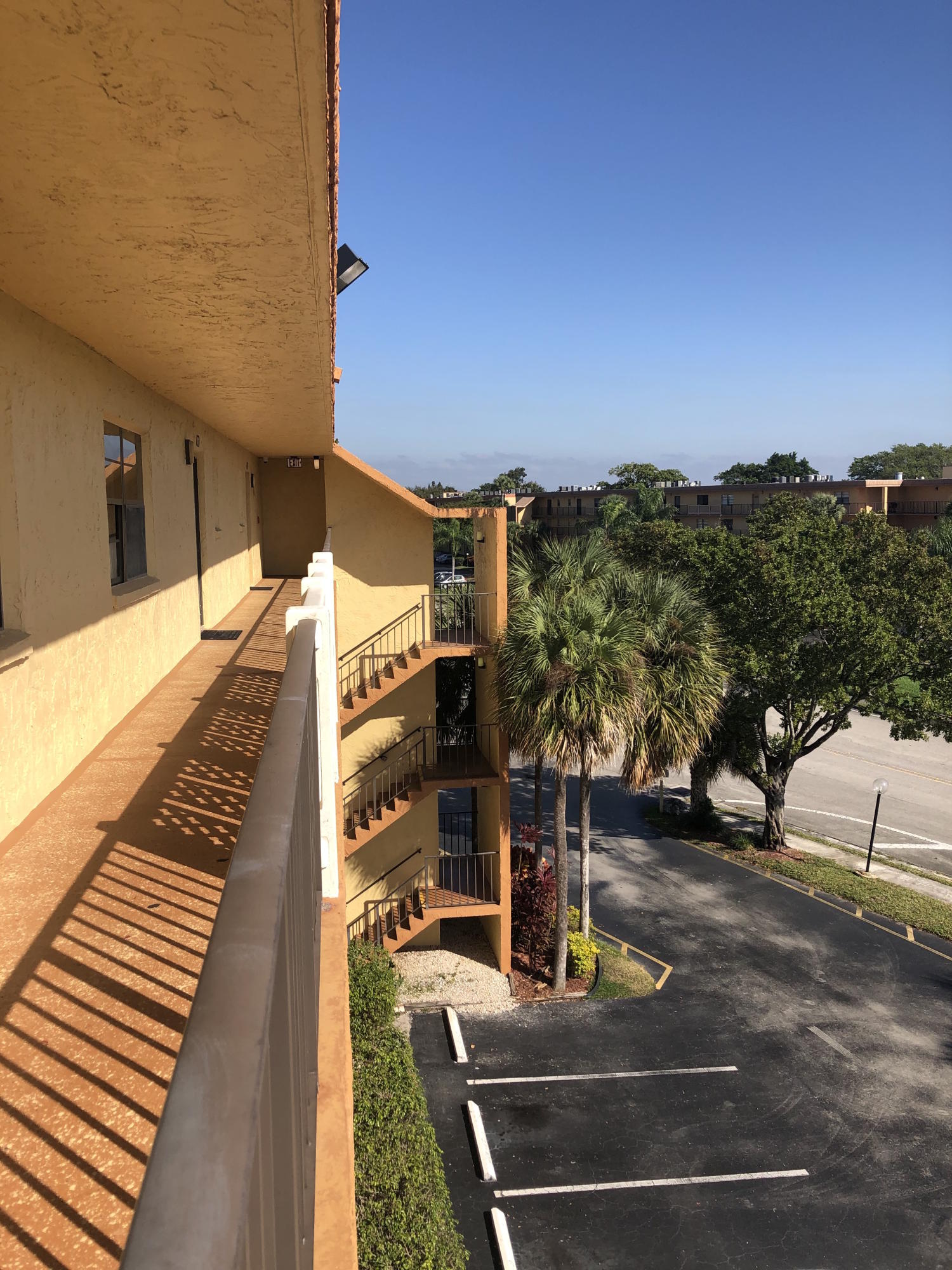 9273 Southwest 8th Street, Unit 411 Boca Raton, FL 33428 - Photo 2 of 24 Walkway