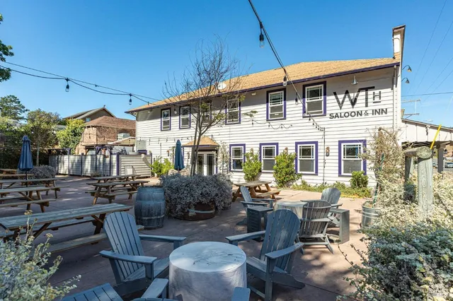 a front view of house with outdoor seating