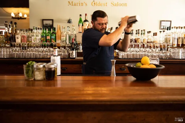 a swimming pool view with a seating space