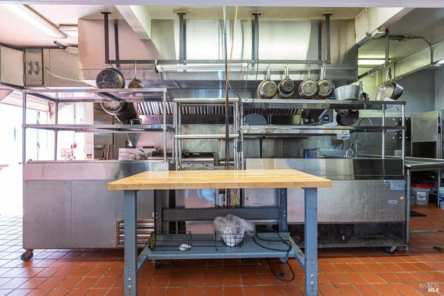 an outdoor space with swimming pool and furniture