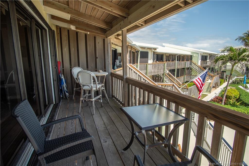 2355 Northeast Ocean Boulevard, Unit 120B Stuart, FL 34996 - Photo 12 of 26 a view of a chairs and table in the balcony