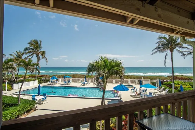 a view of a yard and swimming pool