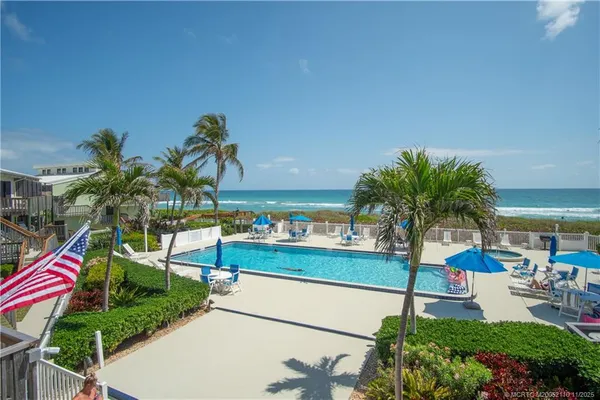 a view of a swimming pool with a terrace