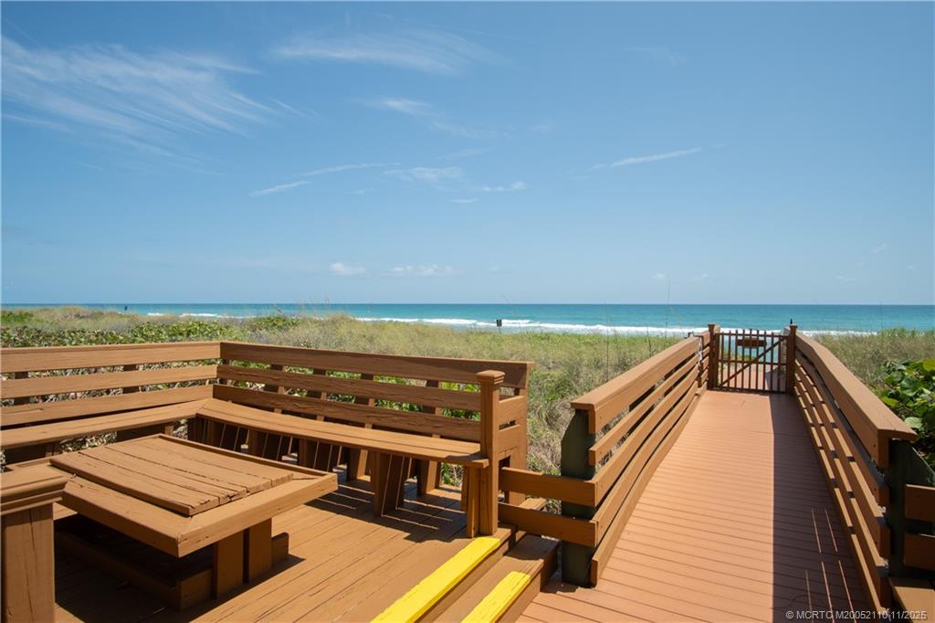 2355 Northeast Ocean Boulevard, Unit 120B Stuart, FL 34996 - Photo 19 of 26 a view of a balcony with wooden floor and outdoor space