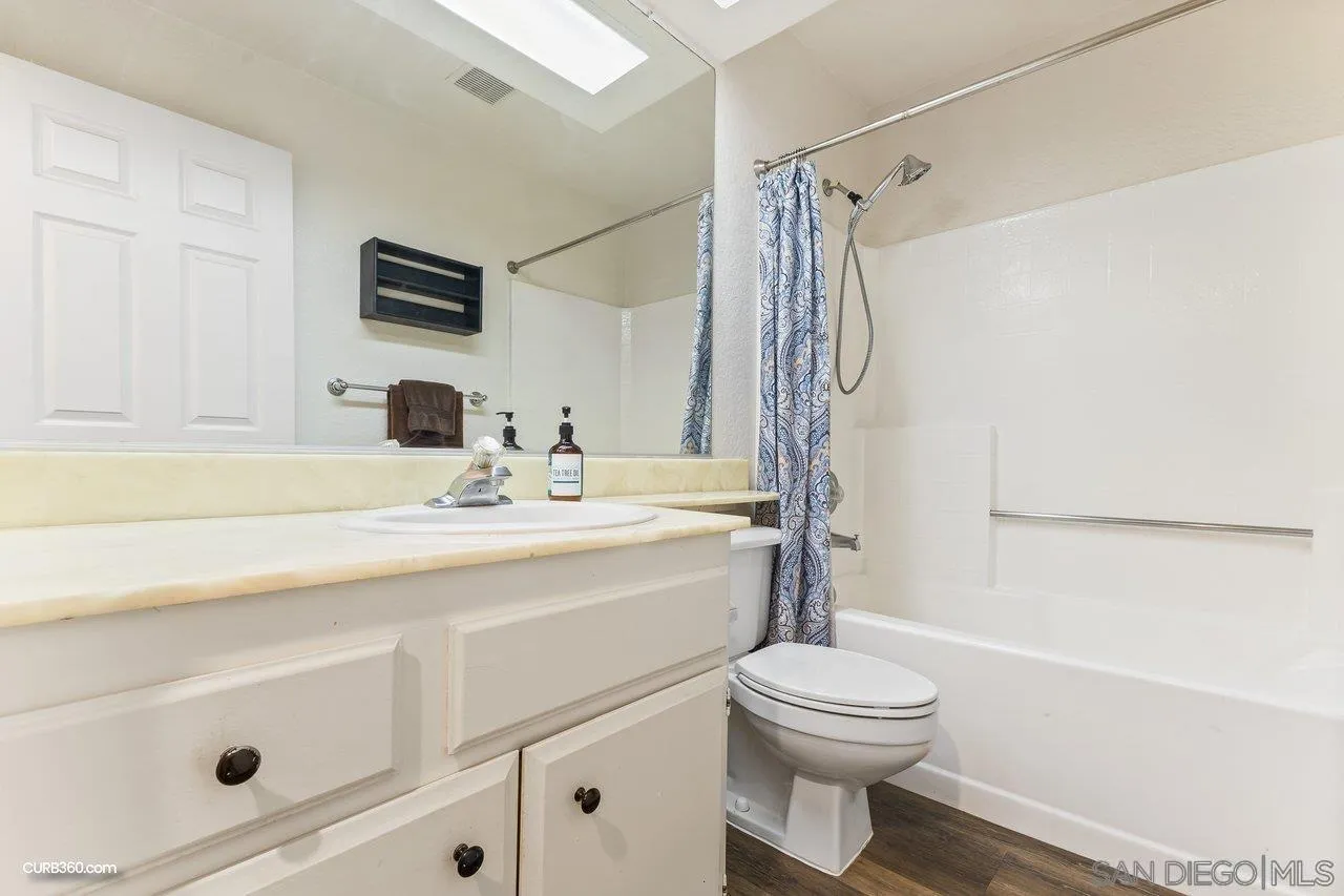 13919 Midland Road Poway, CA 92064 - Photo 3 of 7 a bathroom with a sink a toilet and shower