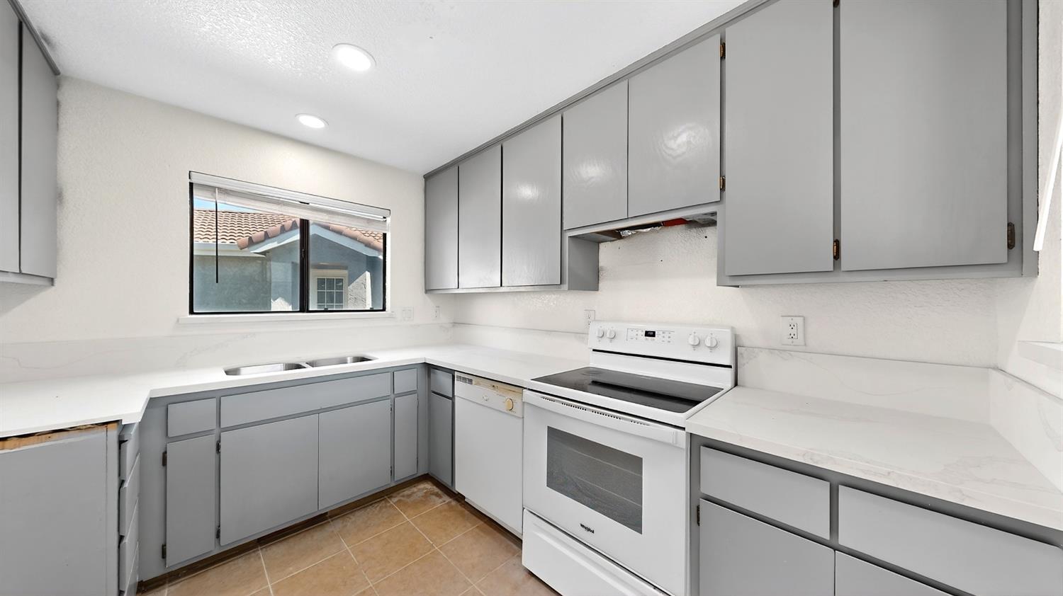 3632 La Mancha Place Turlock, CA 95382 - Photo 14 of 31 a kitchen with sink cabinets and appliances