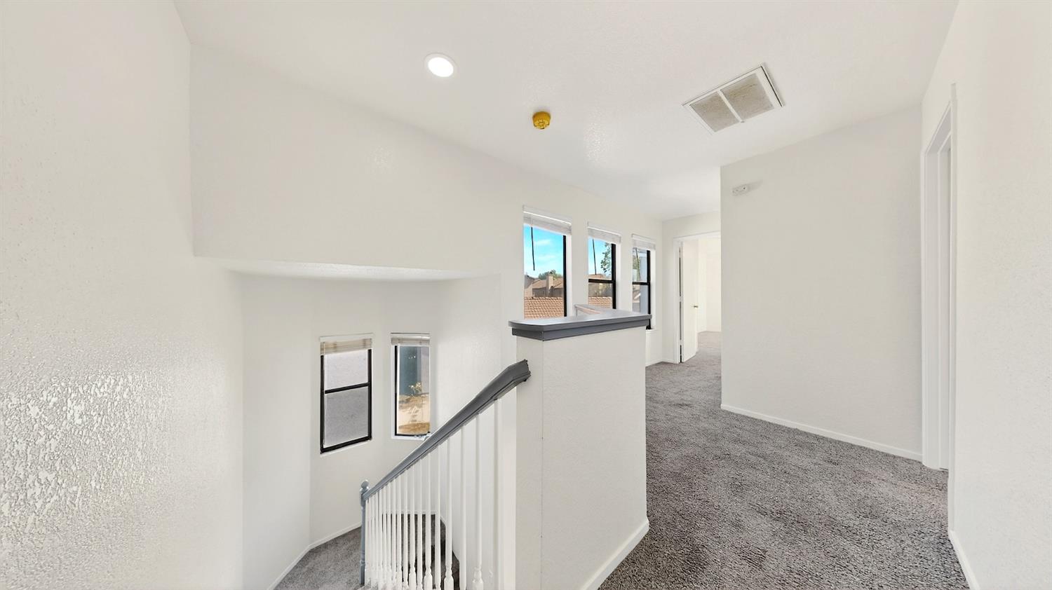 3632 La Mancha Place Turlock, CA 95382 - Photo 17 of 31 a view of entryway with wooden floor and stairs