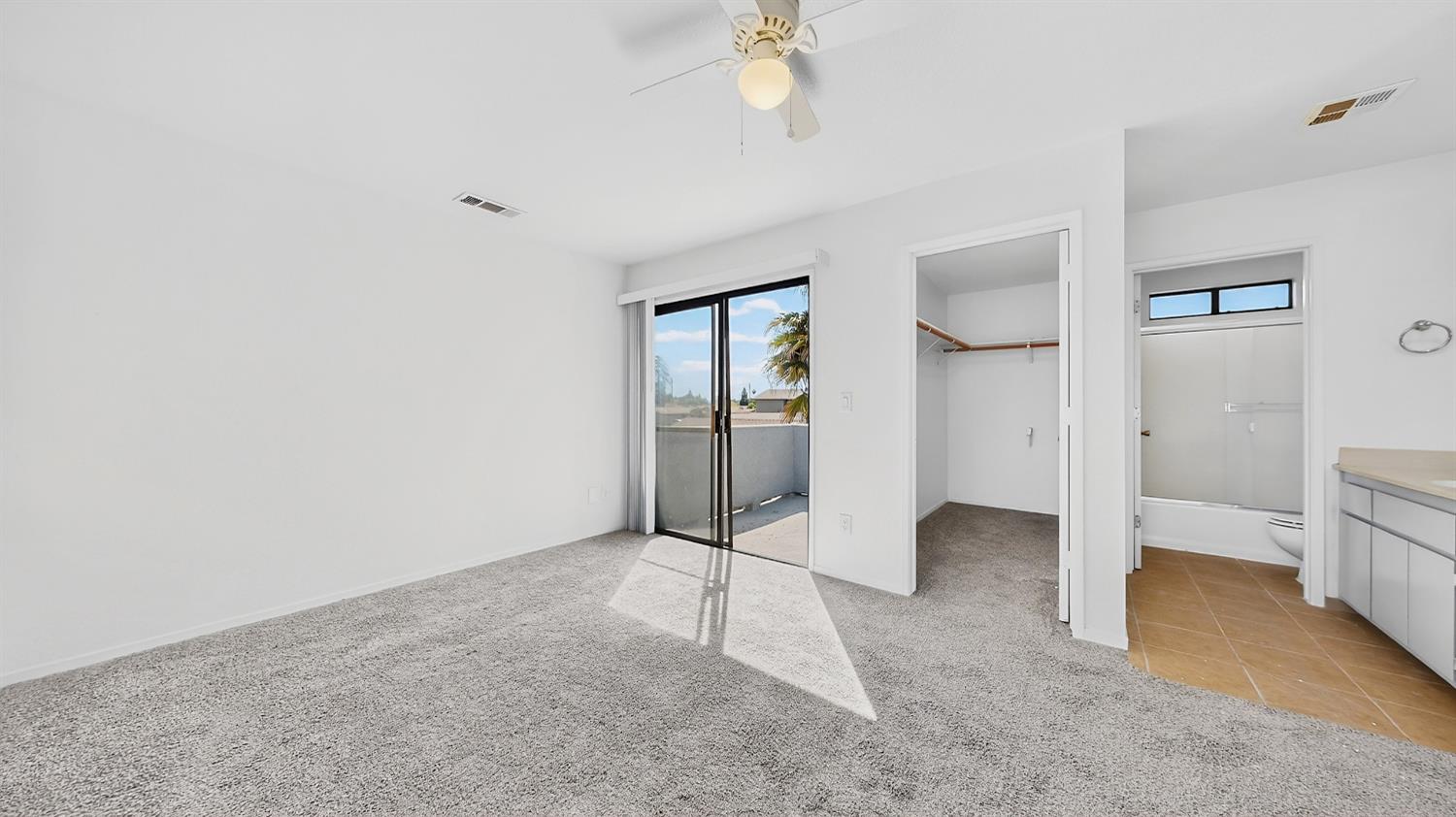 3632 La Mancha Place Turlock, CA 95382 - Photo 22 of 31 an empty room with fan and entrance