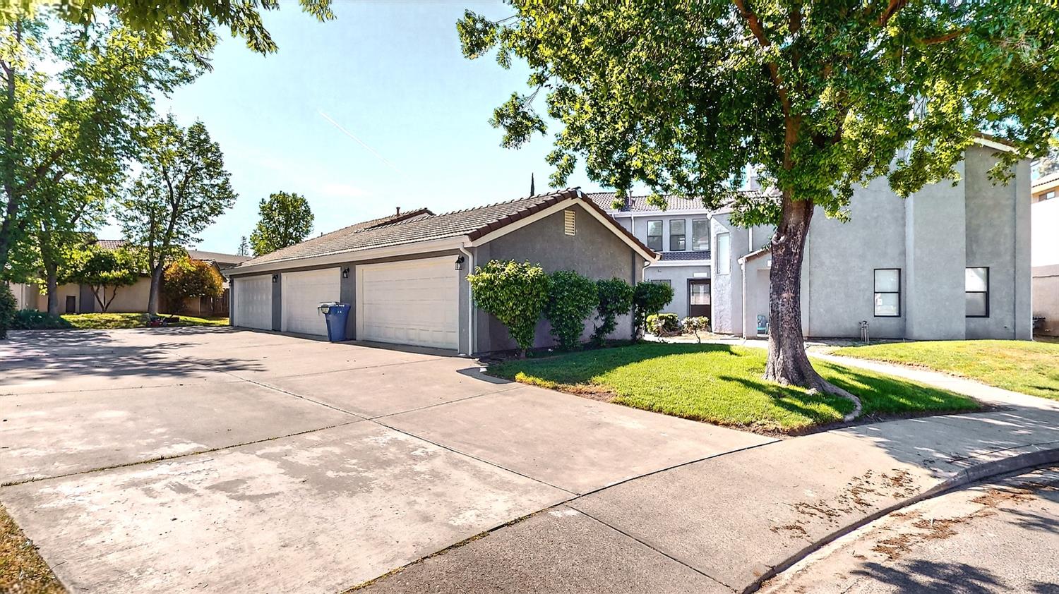 3632 La Mancha Place Turlock, CA 95382 - Photo 4 of 31 a front view of a house with a yard and garage