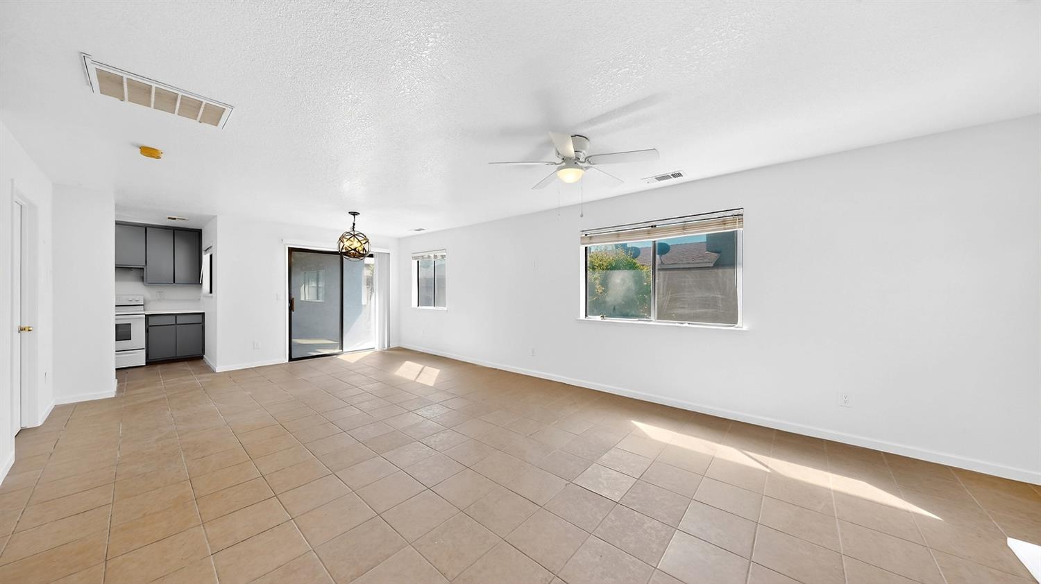 3632 La Mancha Place Turlock, CA 95382 - Photo 6 of 31 an empty room with a empty space and windows