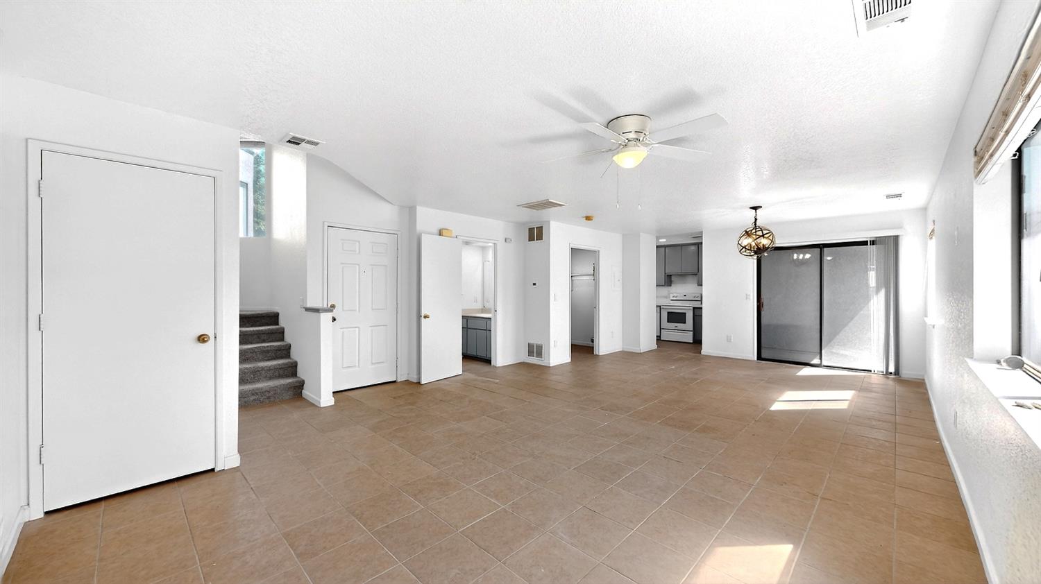 3632 La Mancha Place Turlock, CA 95382 - Photo 8 of 31 a view of empty room with wooden floor and ceiling fan