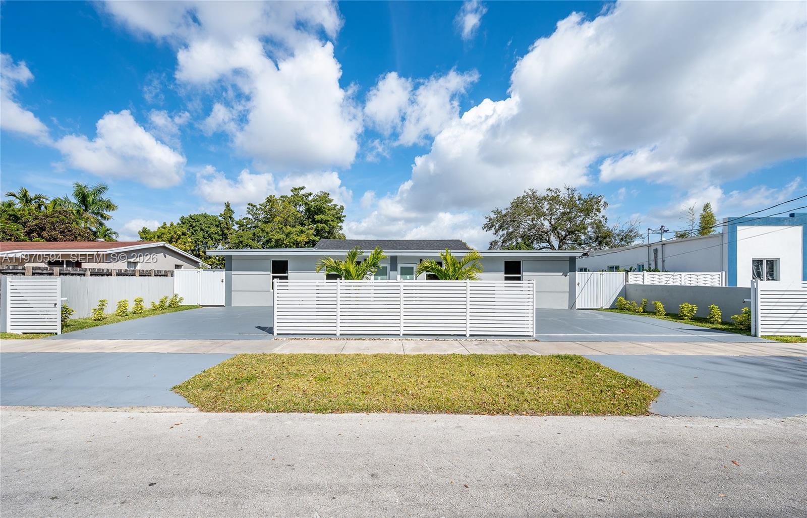 2433 Northwest 97th Street Miami, FL 33147 - Photo 2 of 41 a view of a swimming pool with an outdoor space and seating area